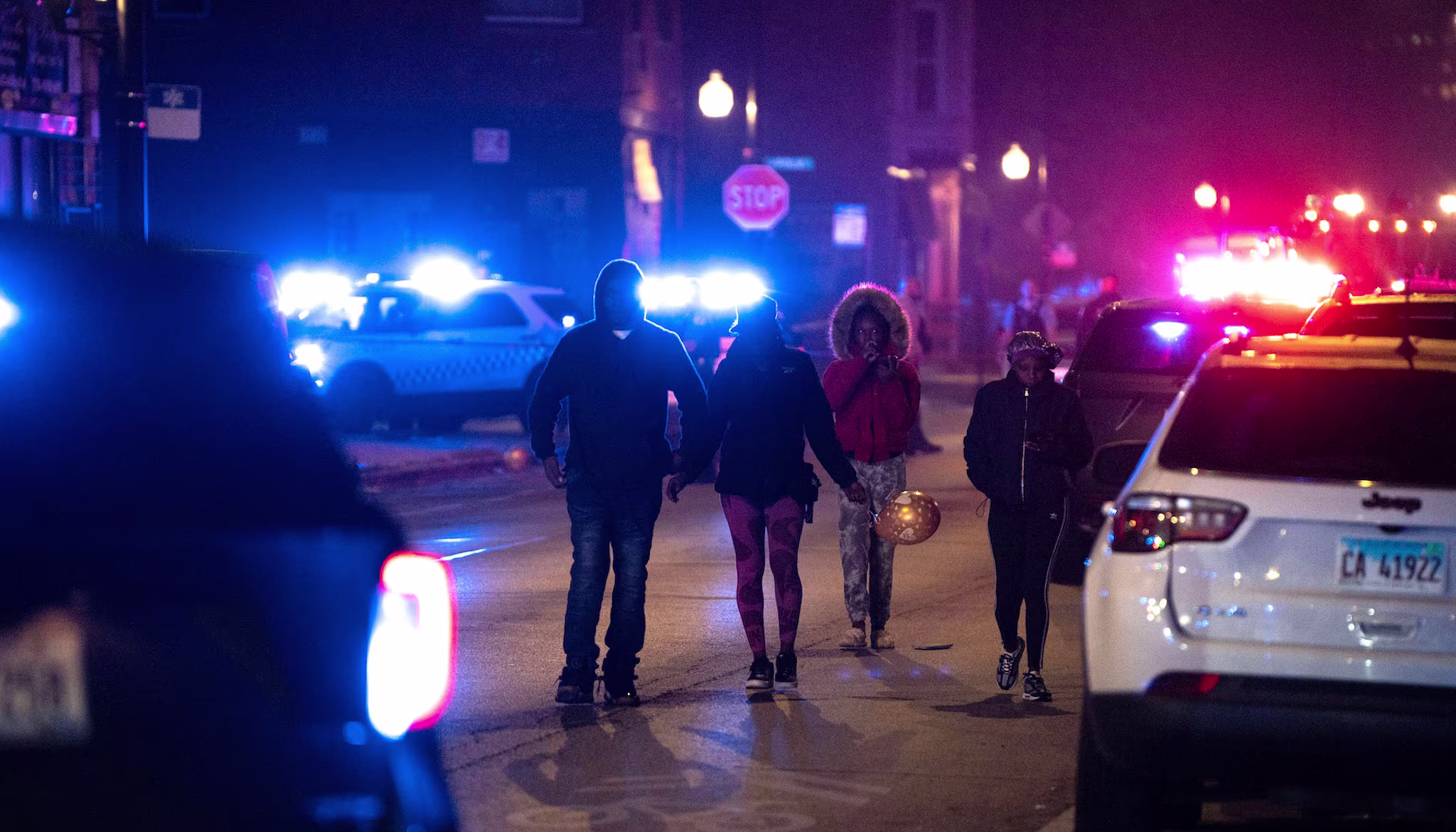 Police investigate the scene where as many as 14 people were shot on Oct. 31, 2022 in Chicago, Illinois