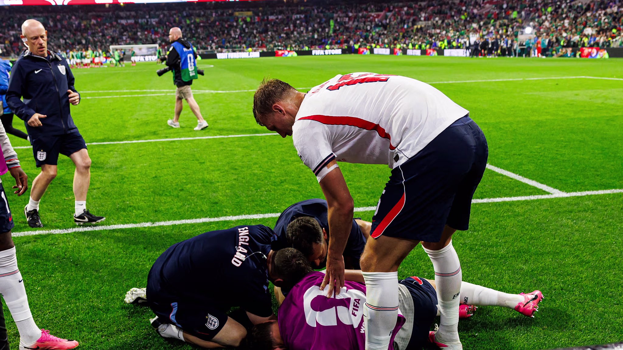 Dan Burn of England (R) tries to help his teammate Jordan Henderson who was injured amid the celebrations after winning the FIFA World Cup 2026 Round Of 16 match between Mexico and England at Mexico City Stadium on July 5, 2026 in Mexico City, Mexico.