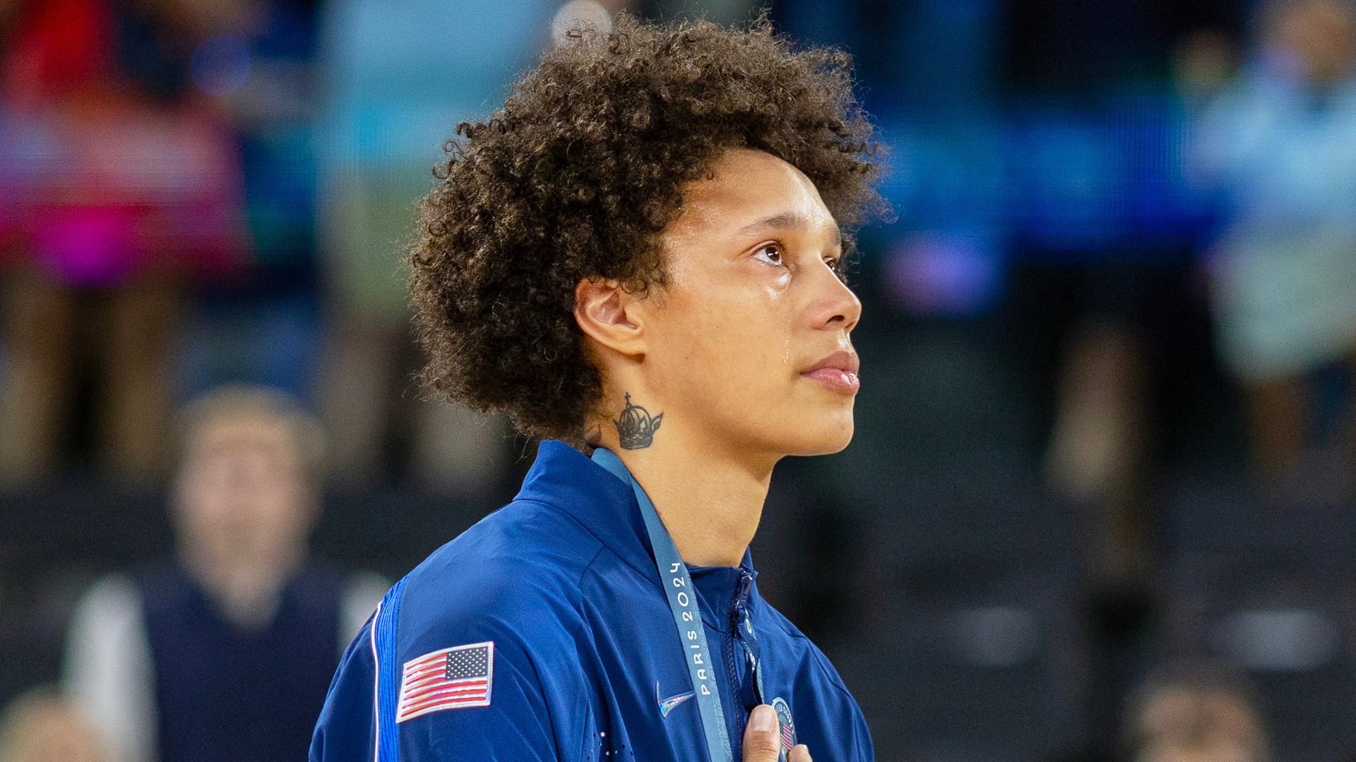 Brittney Griner tears up during national anthem.