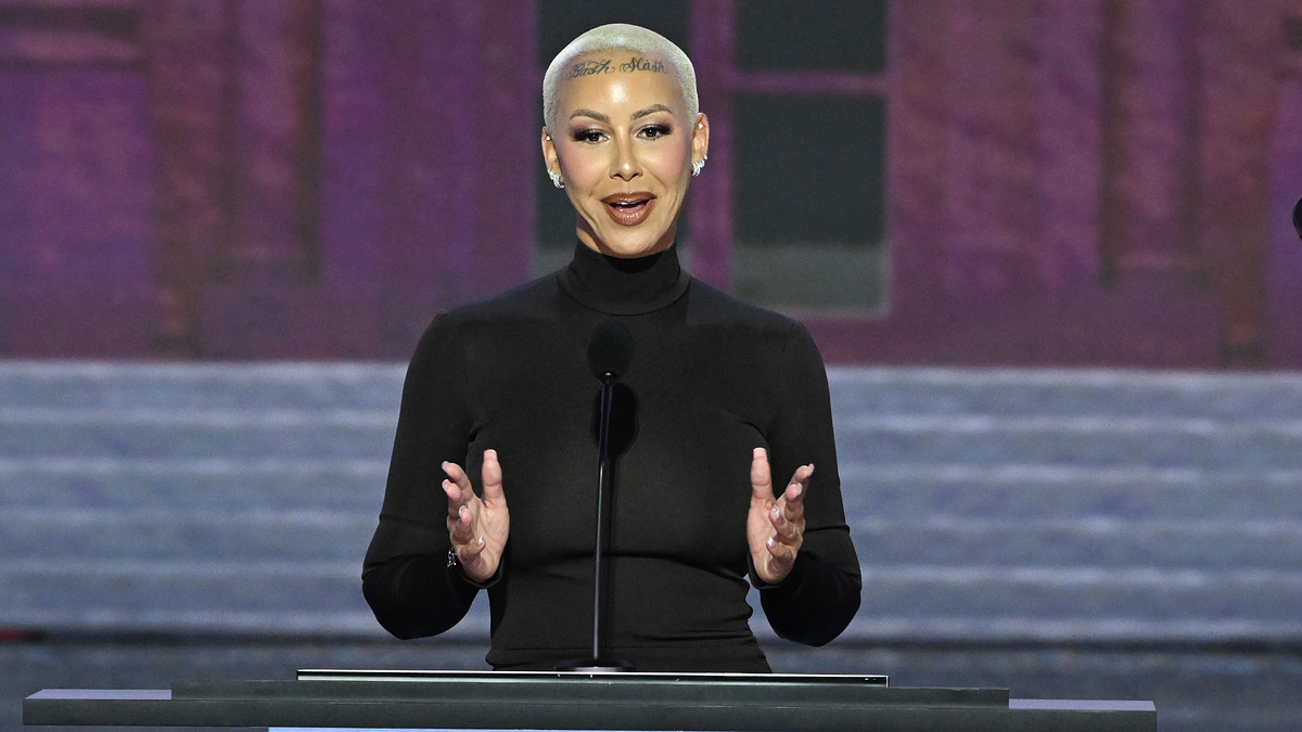 Amber Rose stands behind a podium, speaking on stage at Day 1 of the Republican National Convention on July 15, 2024 in Milwaukee, WI