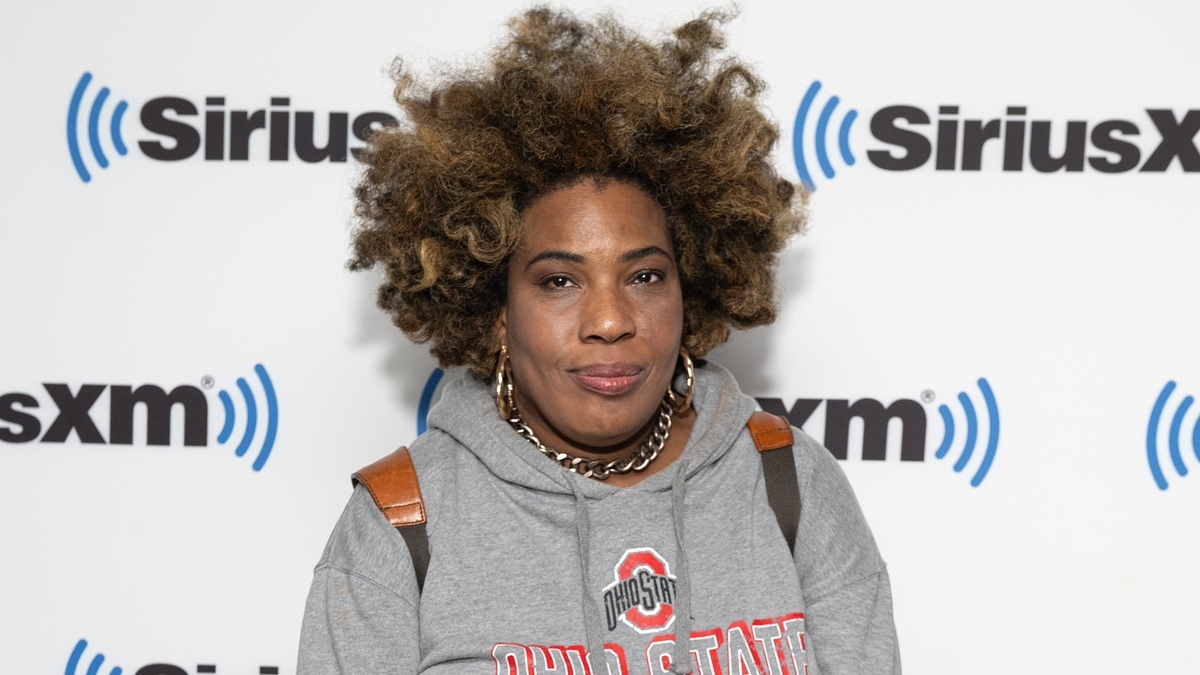 Macy Gray at a SiriusXM event wearing a casual hoodie and statement jewelry