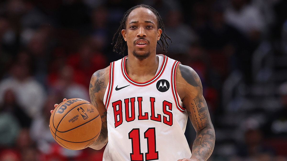 NBA player DeMar DeRozan dribbling the basketball while wearing his Chicago Bulls jersey, number 11, during a game
