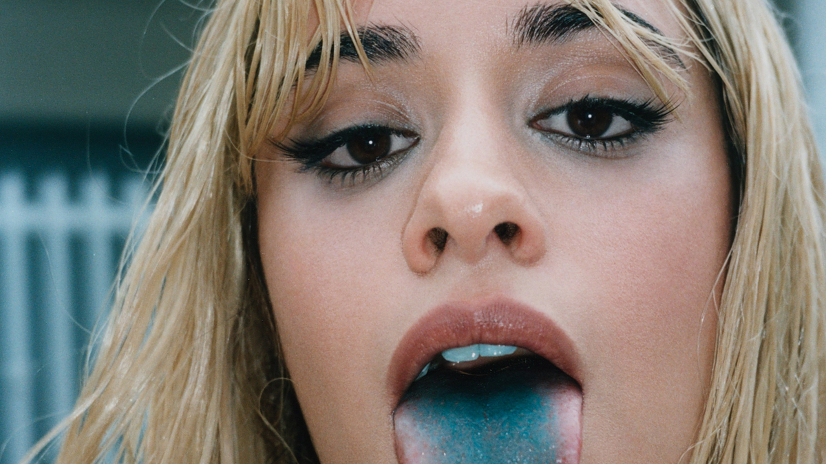Camila Cabello shows her blue tongue in a close-up photo