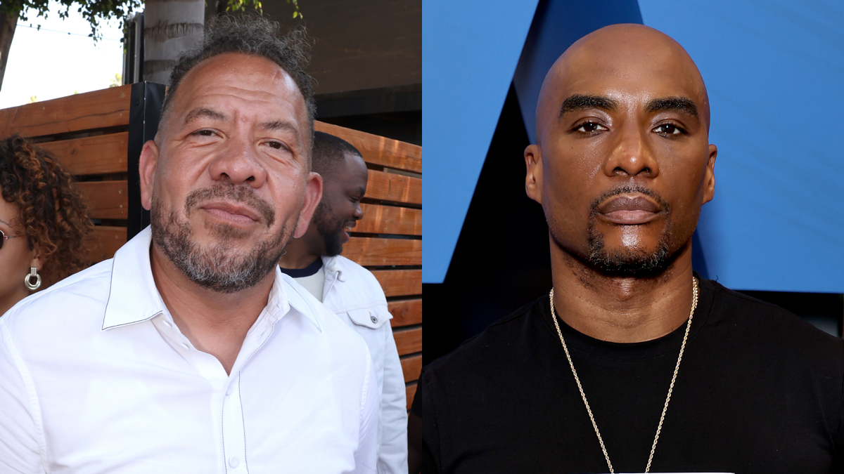Elliott Wilson is wearing a white shirt while Charlamagne Tha God is wearing a black shirt with a gold chain