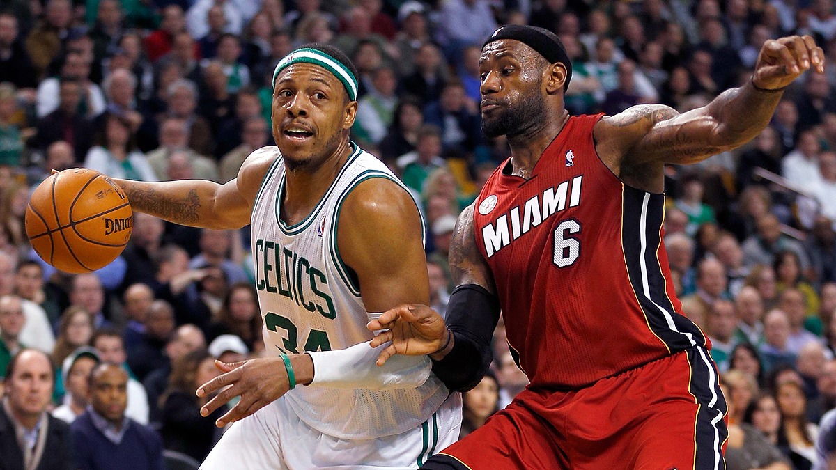 Paul Pierce of the Celtics attempts to drive past LeBron James of the Miami Heat during a basketball game