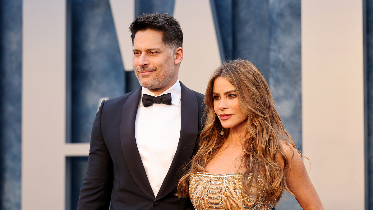 Joe Manganiello in a tuxedo and Sofia Vergara in a strapless, embellished gown pose together at a formal event