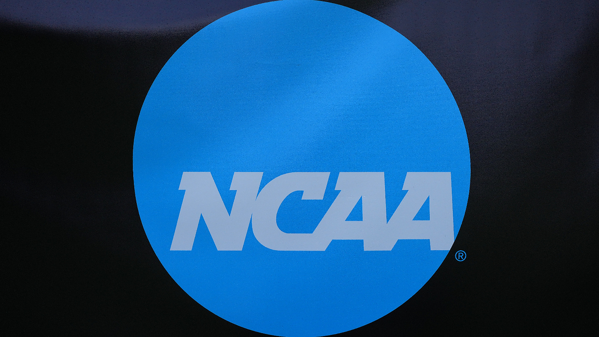 NCAA logo displayed on a blue circle against a dark background