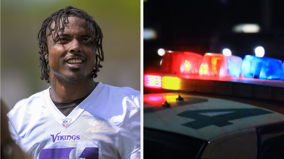 Khyree Jackson on the left smiling and looking slightly to the side on a field. Flashing lights on a police car on the right.