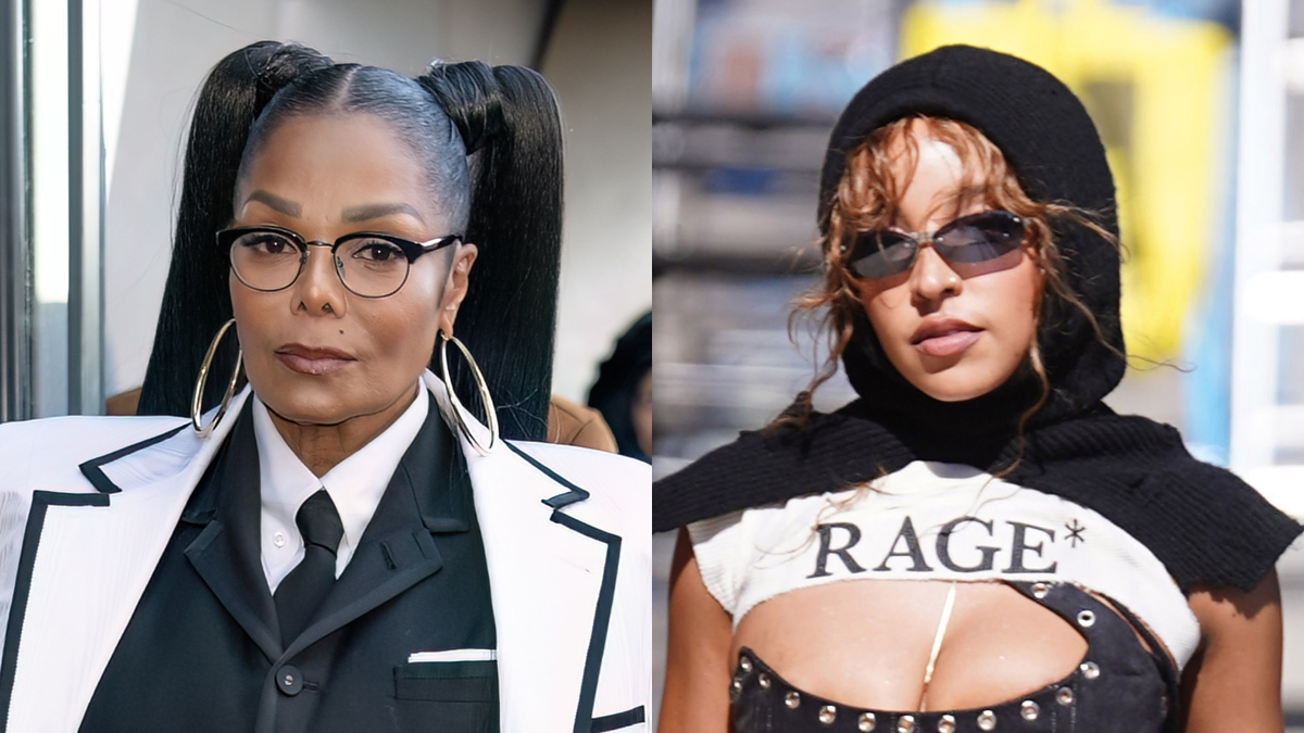 Janet Jackson in a tailored suit with large hoop earrings and glasses next to Tinashe wearing a black hood, sunglasses, and a “RAGE” crop top