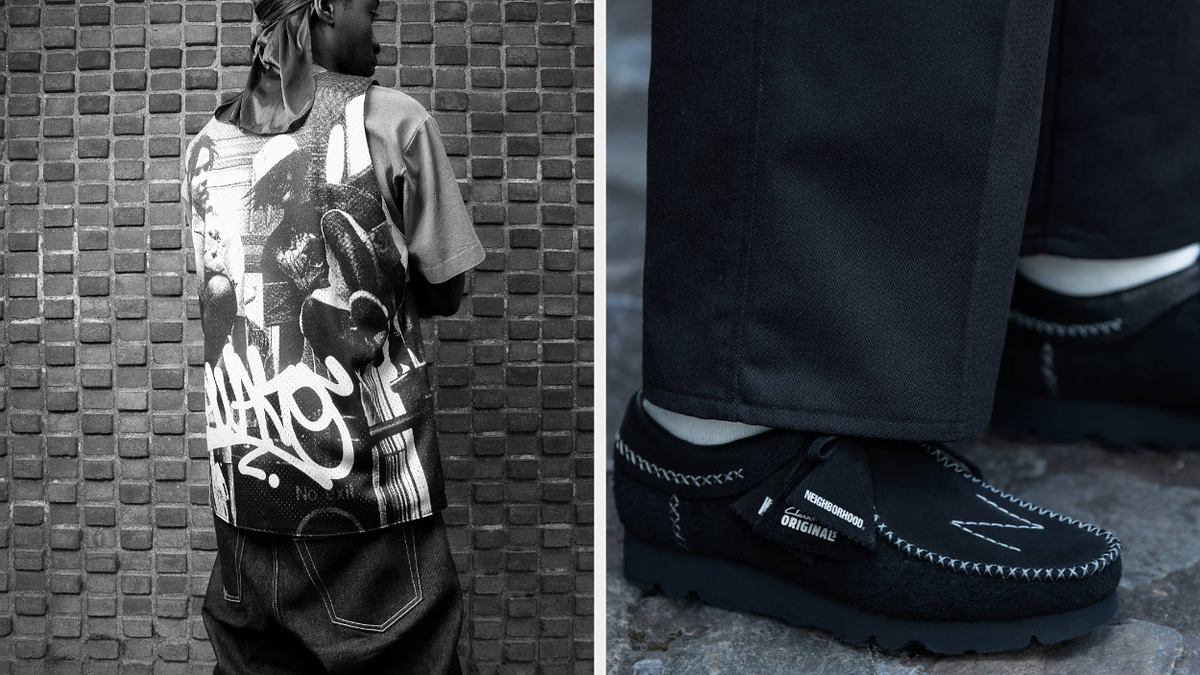 A person stands with their back to the camera wearing a shirt and pants with graffiti-style designs and black shoes featuring visible stitching
