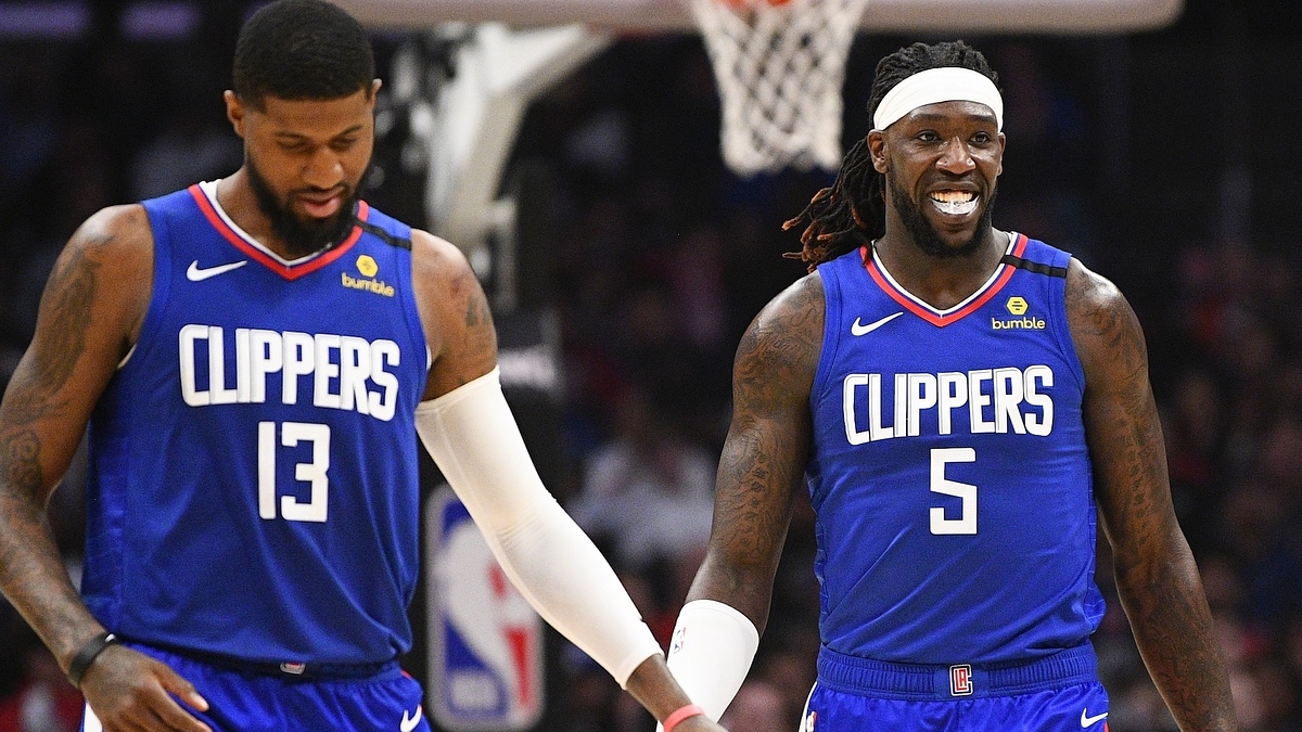 Paul George and Montrezl Harrell of the Los Angeles Clippers basketball team on the court, both wearing their team jerseys