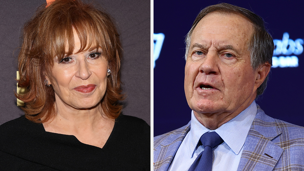 Joy Behar in a black top next to Bill Belichick in a suit and tie