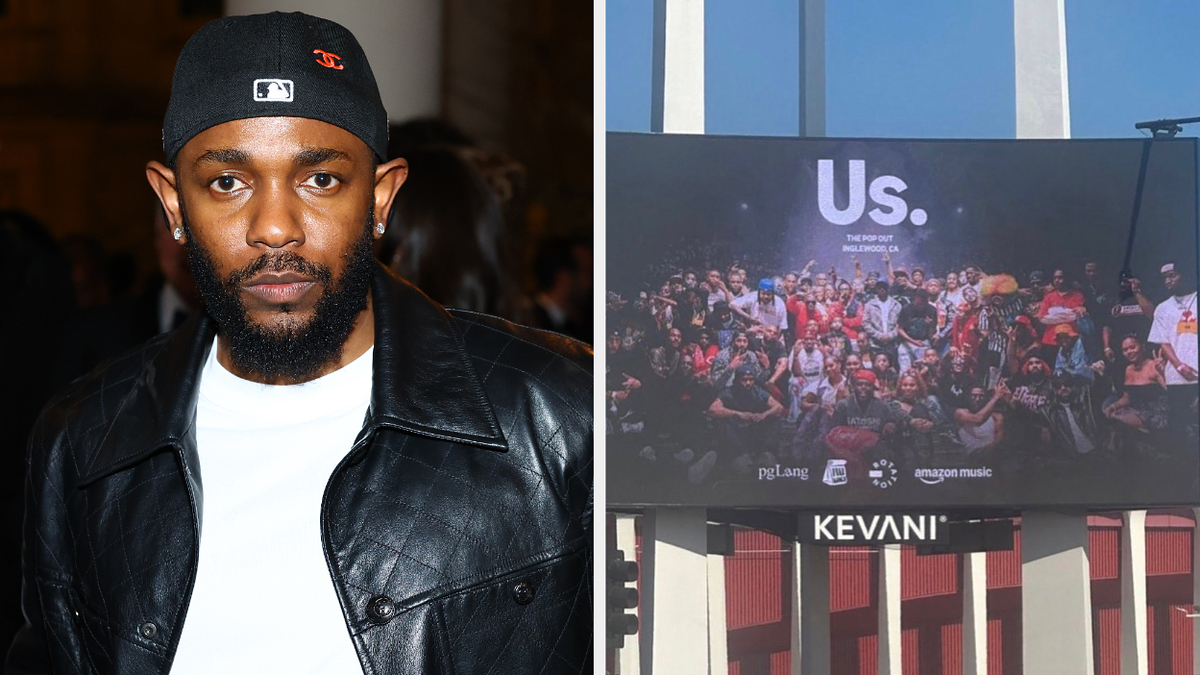 Kendrick Lamar wearing a leather jacket and black hat next to a billboard showing a group photo with the text "Us." and logos for pgLang and Amazon Music