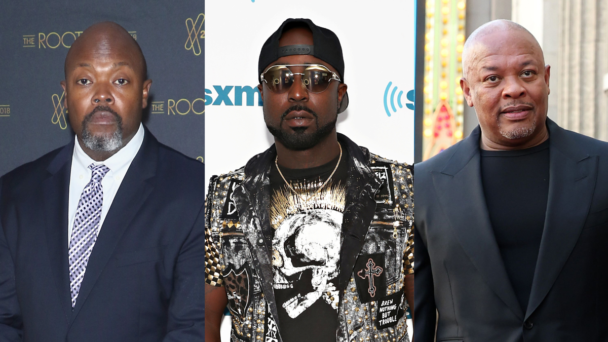 From left to right, the image shows three men: Mike Jackson, Young Buck, and Dr. Dre. Young Buck wears a studded leather jacket with a skull design