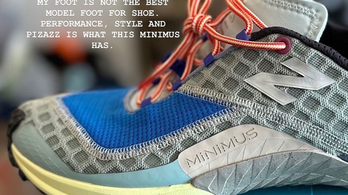 Close-up of a New Balance Minimus sneaker on a blue box, with text reading, "My foot is not the best model foot for shoe performance, style and pizazz is what this Minimus has."
