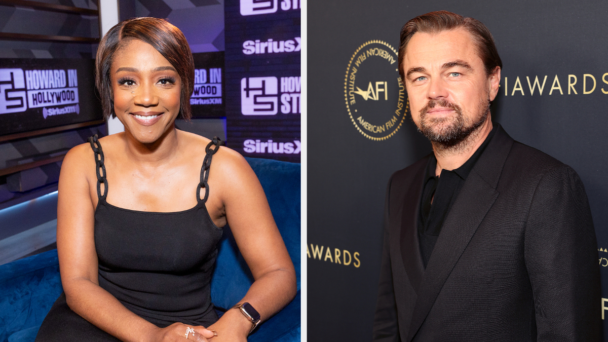 Tiffany Haddish in a black dress with chain straps smiles at the camera. Leonardo DiCaprio, wearing a black suit, poses at a media wall event