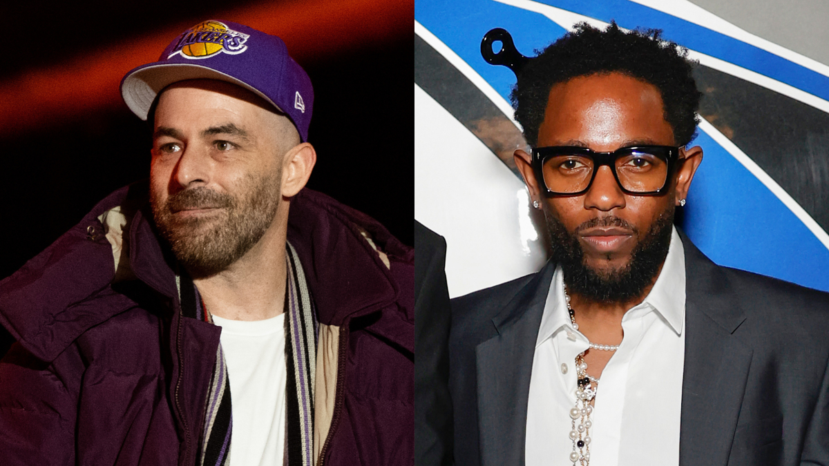Two men, Derrick Waters in casual wear and a Lakers cap, and Kendrick Lamar in a suit with a white shirt and glasses