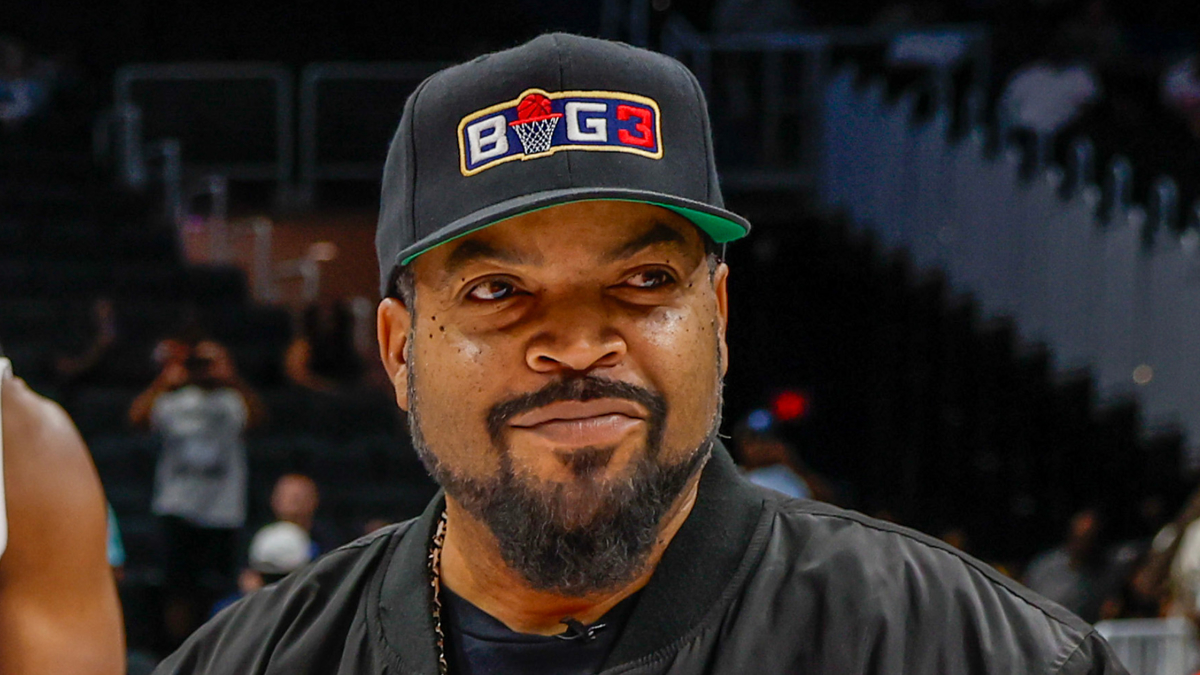 Man in a cap with 'BIG3' logo, casual attire, at a sporting event
