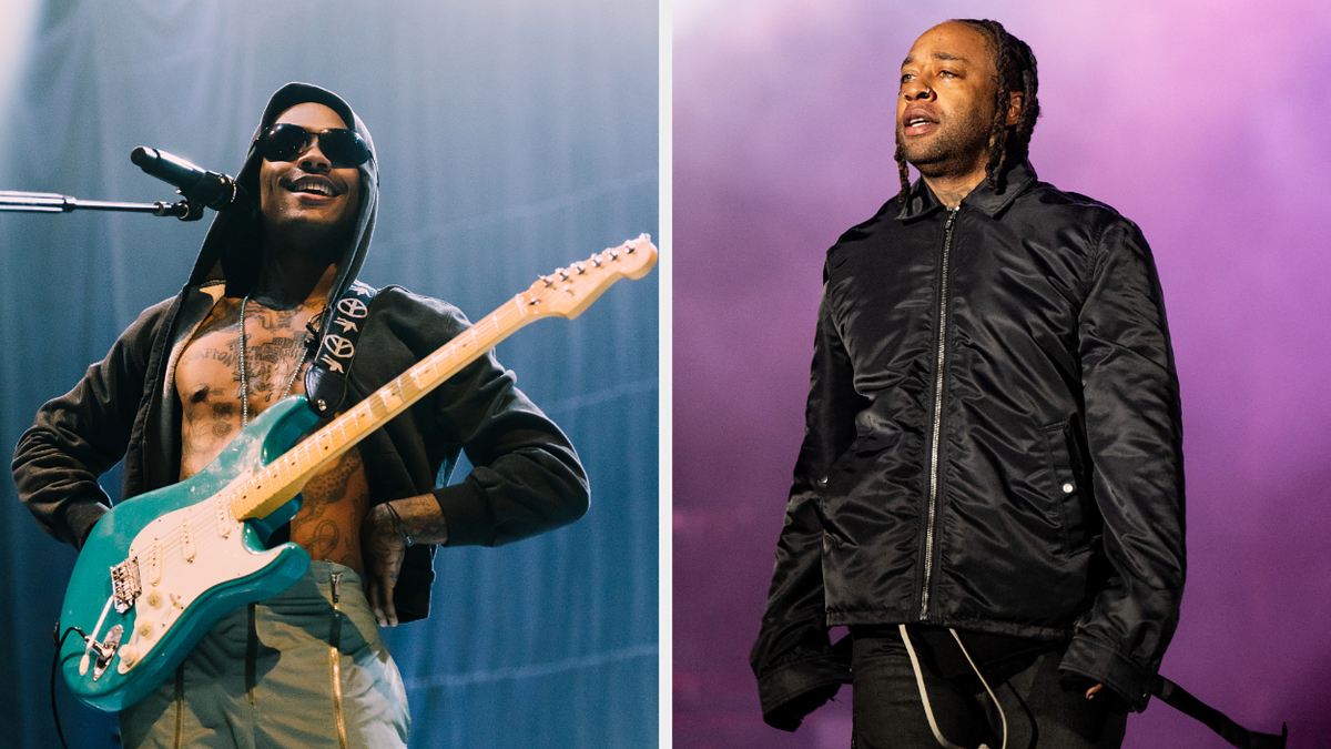 Wizkid performs playing electric guitar; Ty Dolla $ign stands on stage in a black jacket and pants