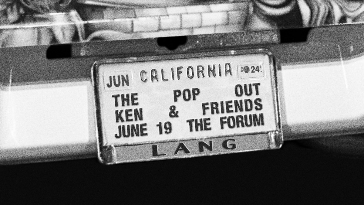 License plate promoting "The Pop Out" concert with Ken & Friends at The Forum on June 19