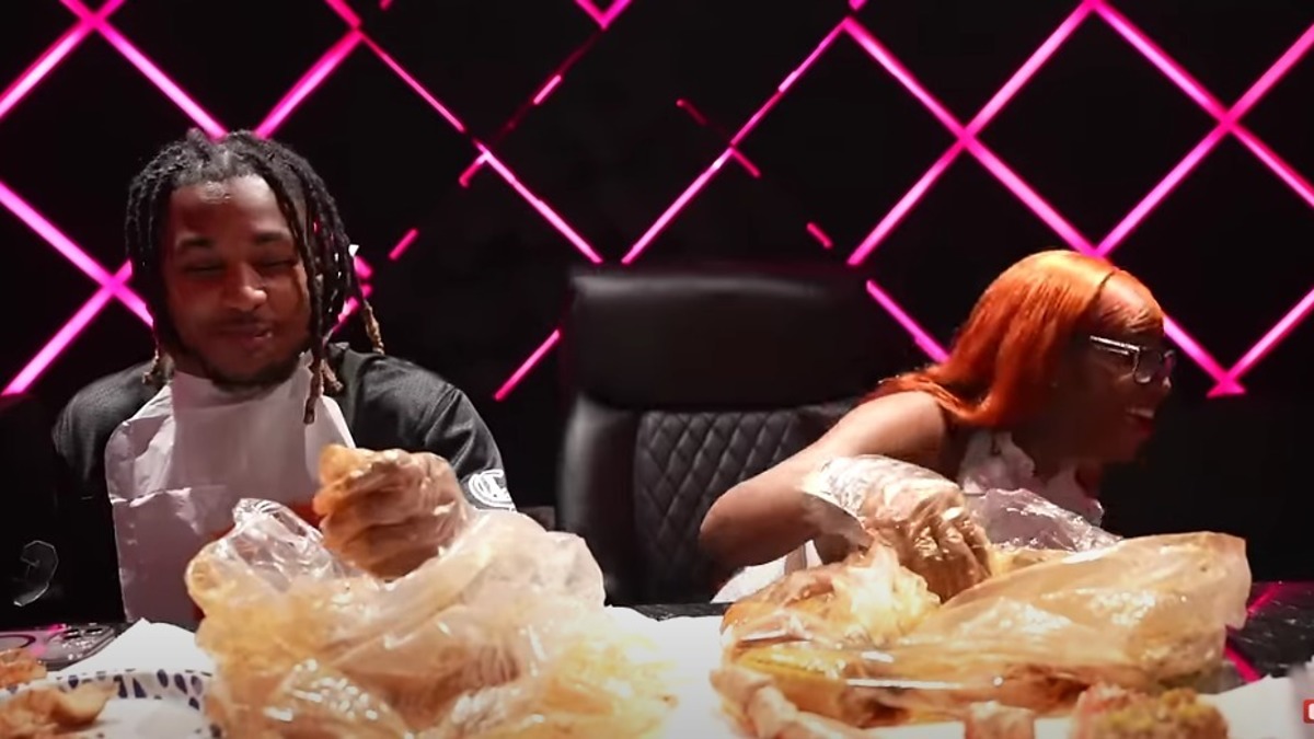 DDG and Mary J. Blige enjoying a seafood meal together with bibs and gloves on