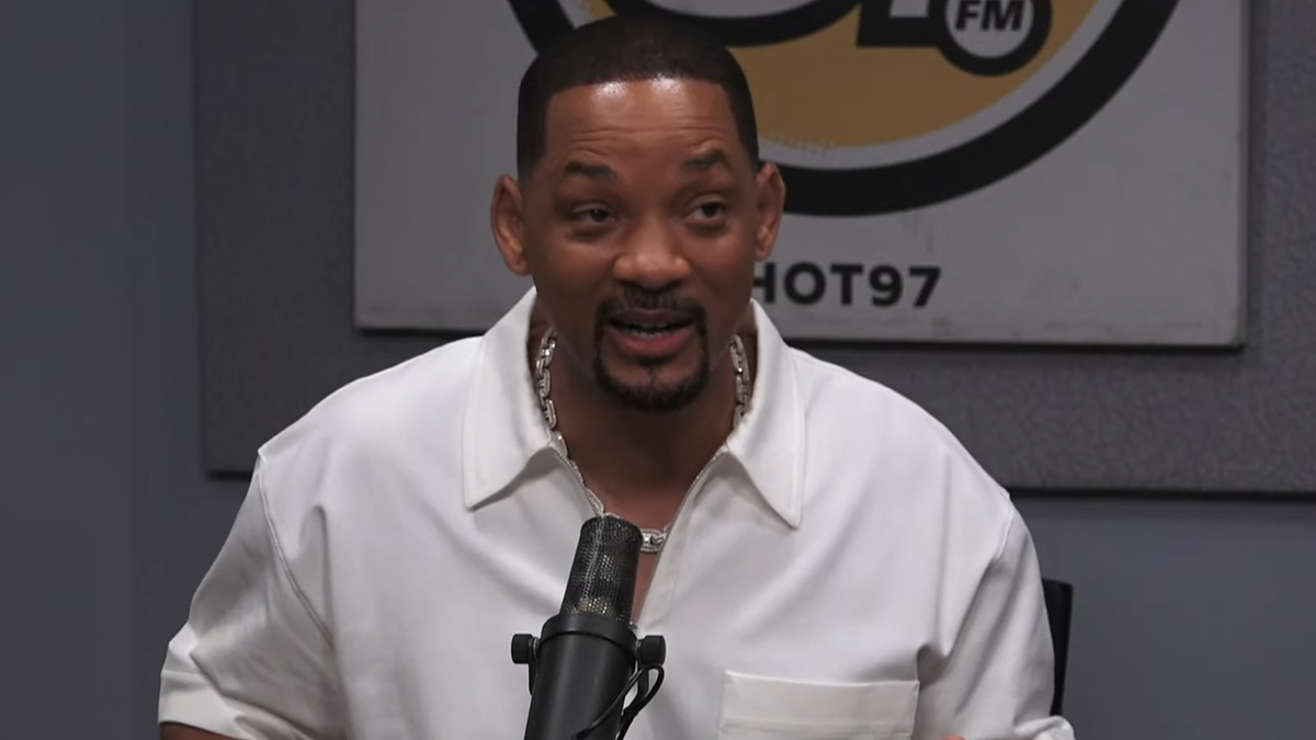 Will Smith speaking into a microphone during a radio interview at Hot 97 FM