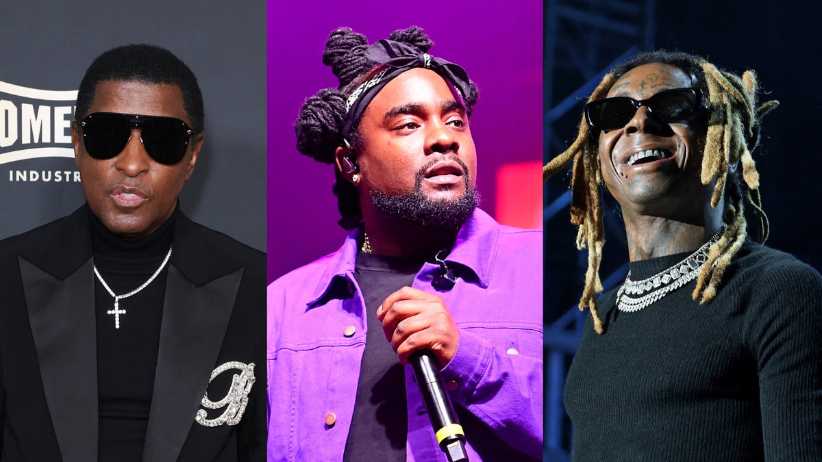 Kenneth "Babyface" Edmonds in a black suit with cross necklace, Wale in a purple jacket with microphone, and Lil Wayne wearing sunglasses and necklace