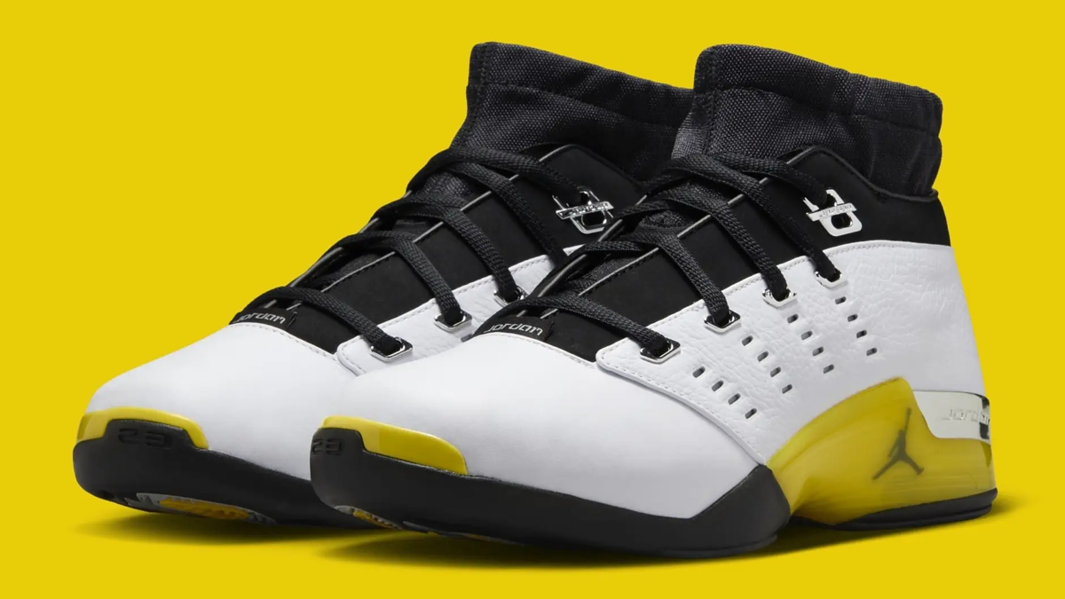 Pair of Jordan sneakers featuring a sleek design with a knit collar, white upper, and distinctive yellow accents