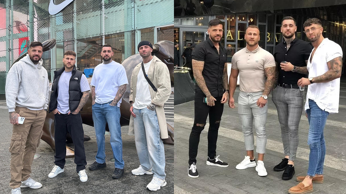 Group of five men posing for a photo, dressed casually with varying styles of tops, jeans, and mostly sneakers