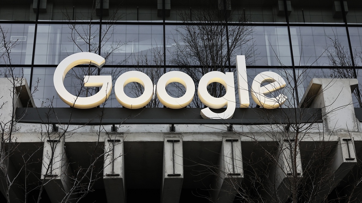 The image shows the Google logo on the exterior of a building. The logo is large and prominently displayed