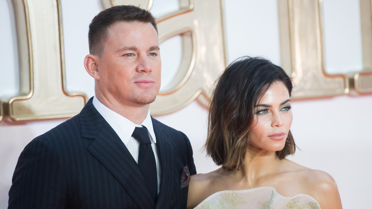 Channing Tatum and Jenna Dewan at an event, wearing a suit and an embroidered gown respectively