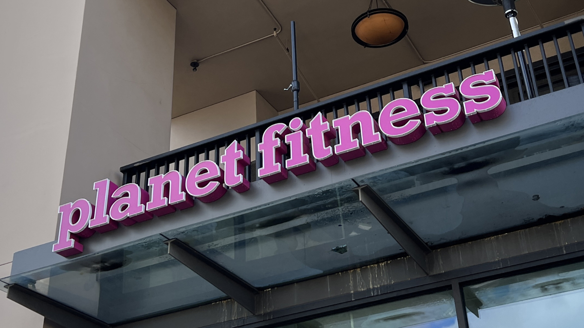 Sign for Planet Fitness gym on a building facade