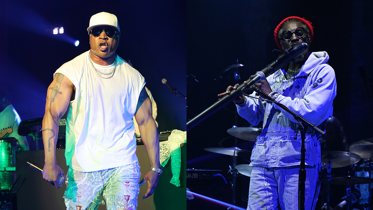 Two musicians on stage, one in casual attire with sunglasses and the other in a hoodie and denim, both performing