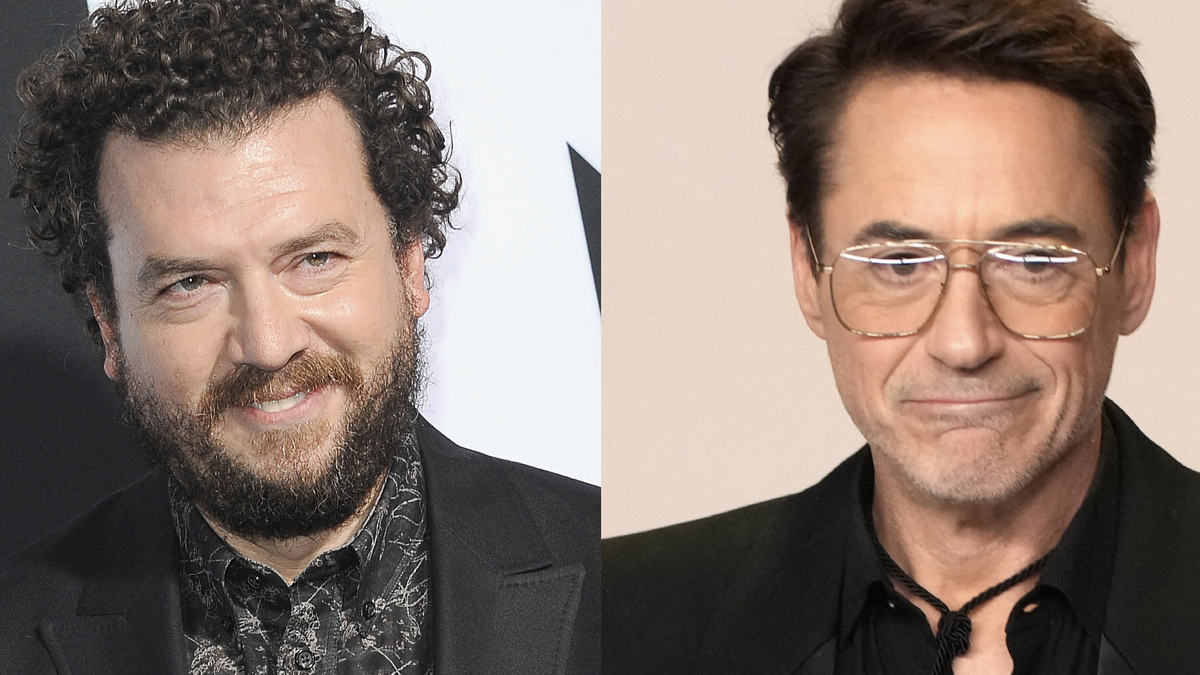 Danny McBride and Robert Downey Jr. side by side, both in formal attire. McBride smiles, Downey has a serious expression