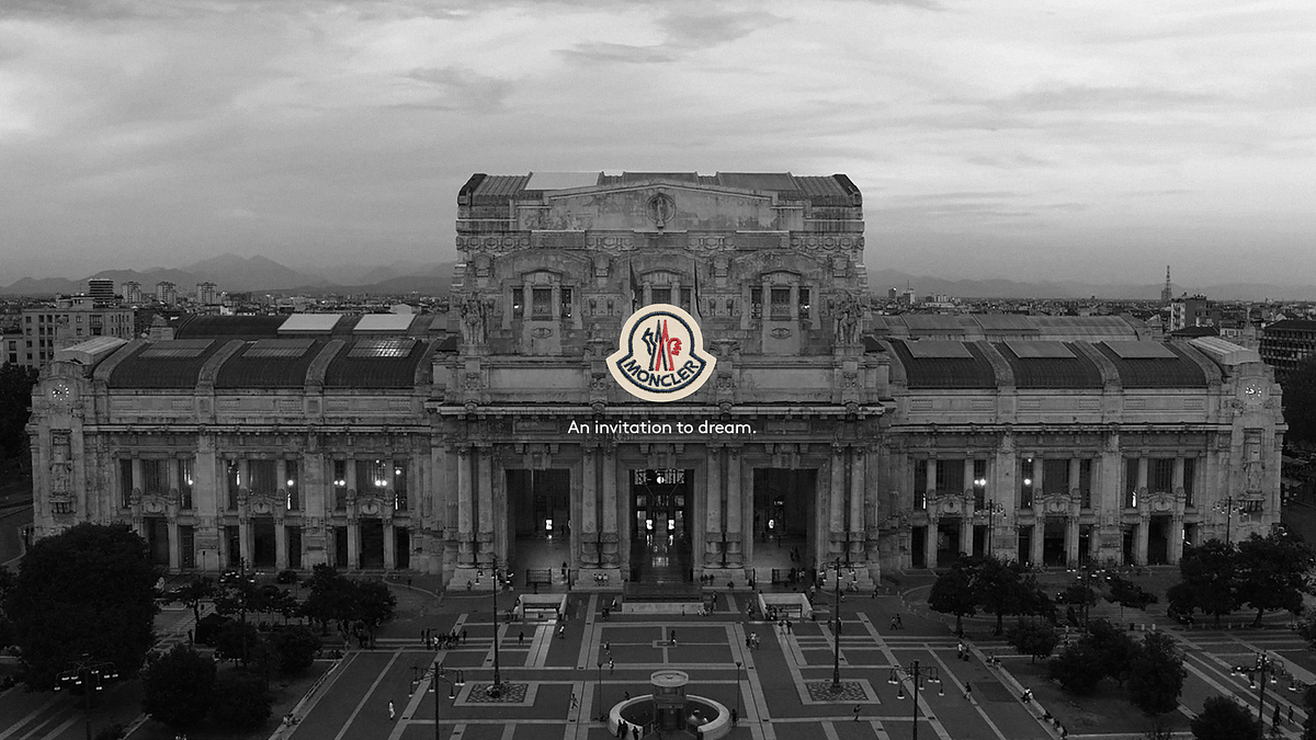 Palace facade with a central emblem and slogan "An invitation to dream" displayed, evoking grandeur and aspiration