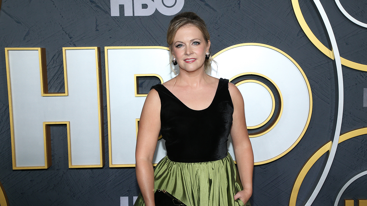 Amy Adams in a black velvet top and green skirt at an HBO event