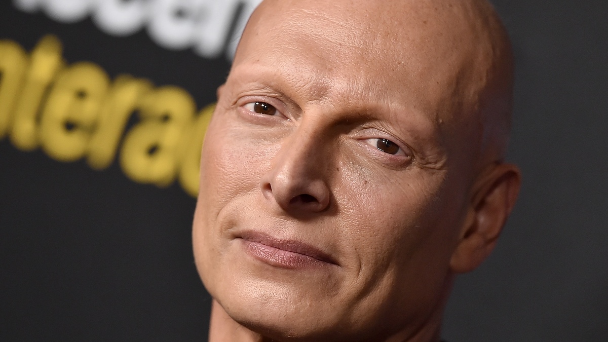 Man in suit posing for camera
