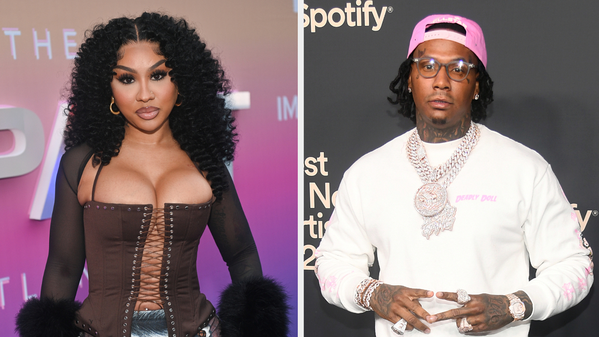 Ari "the Don" Fletcher in a corset-style outfit and Moneybagg Yo wearing a sweater with chain necklaces at an event