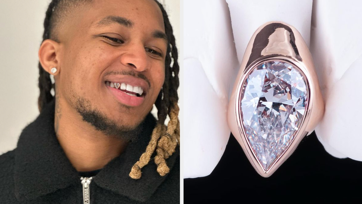 Man smiling with a diamond inlaid in his forehead