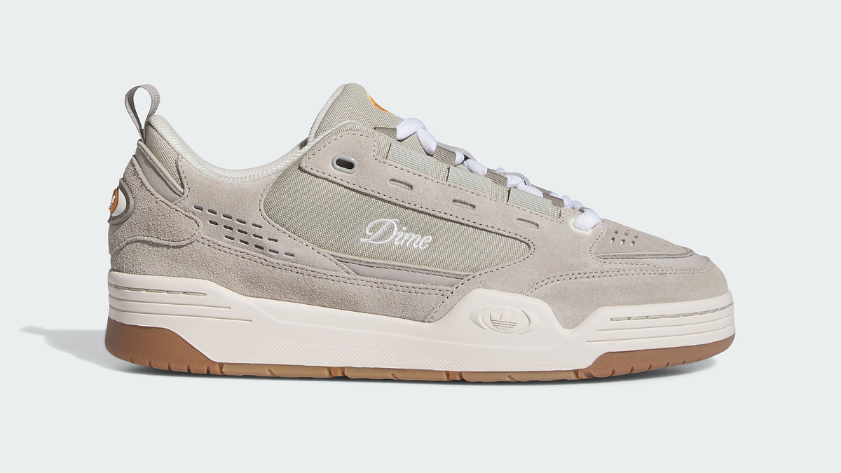 A single grey Dime sneaker with distinctive perforations and a chunky brown sole, displayed against a plain background