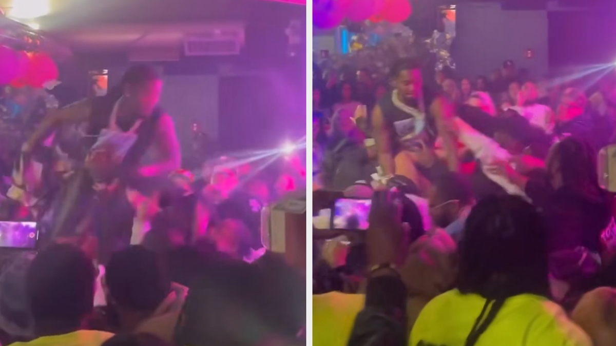 Offset jumping into crowd at a strip club with fans reaching out
