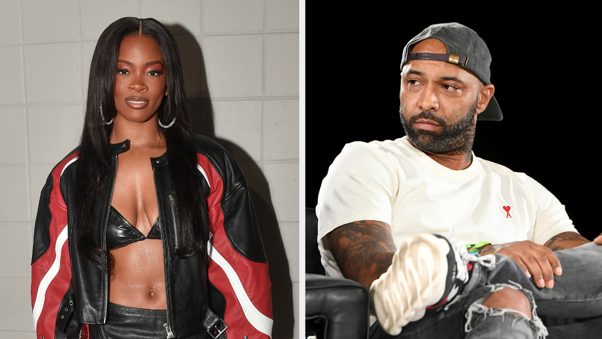 Ari Lennox wearing a black and red jacket with a crop top. Joe Budden in a white shirt and cap, sitting separately