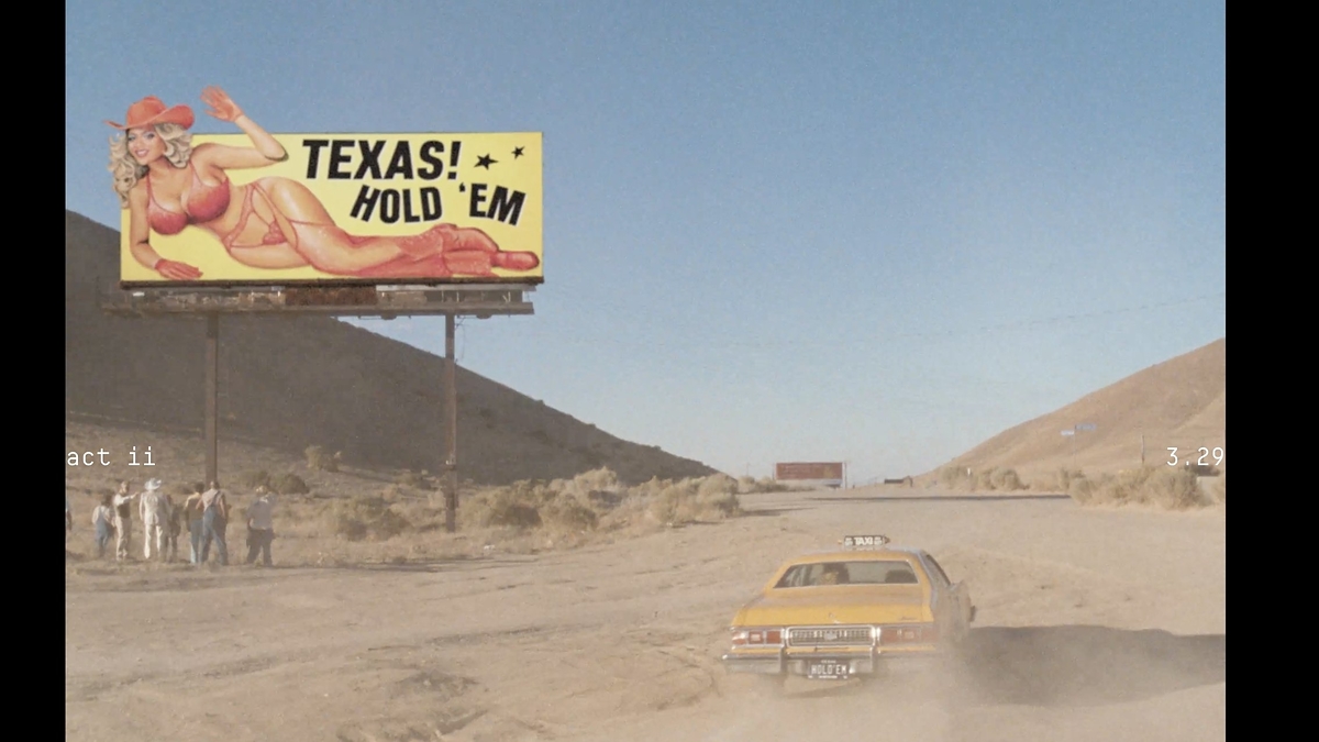 A desert scene with a yellow car driving on a dirt road. A large billboard displays a cartoon cowgirl and the text "TEXAS! HOLD 'EM."