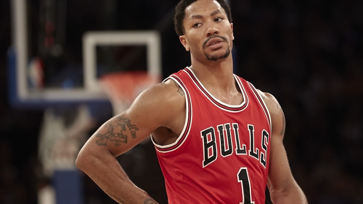 Derrick Rose in a Chicago Bulls uniform on the basketball court, looking focused
