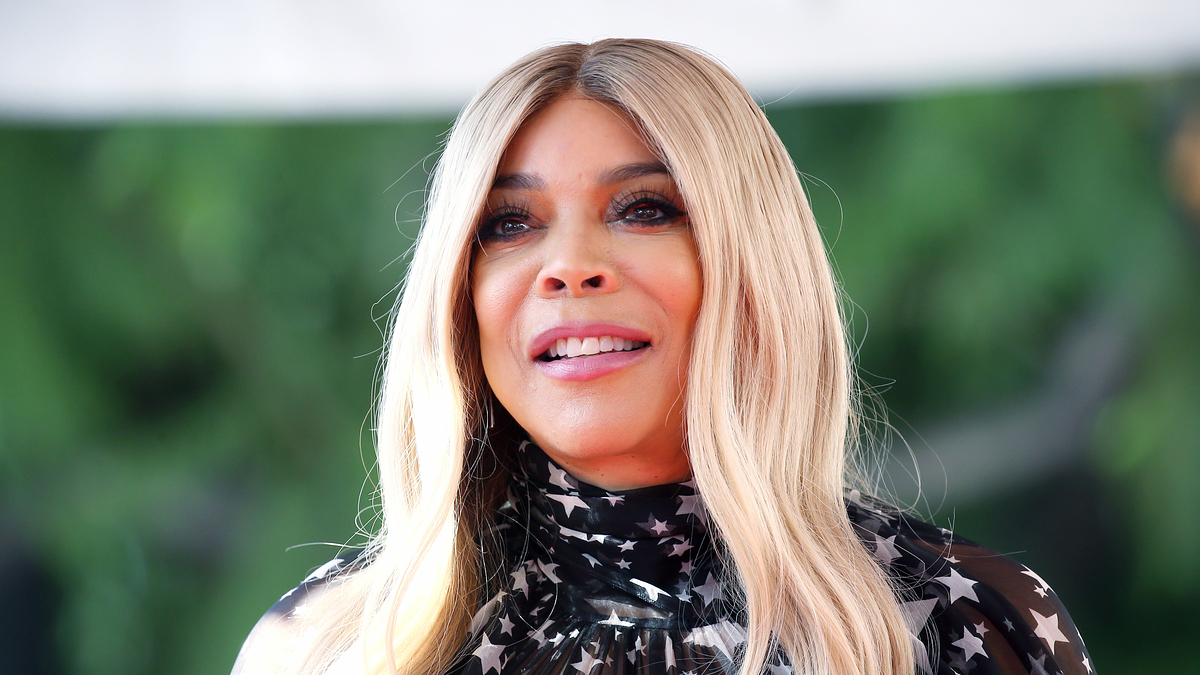 Wendy Williams in a high-neck, star-patterned outfit
