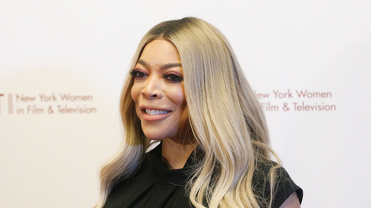 Wendy Williams in a black outfit at the NYWIFT event, smiling