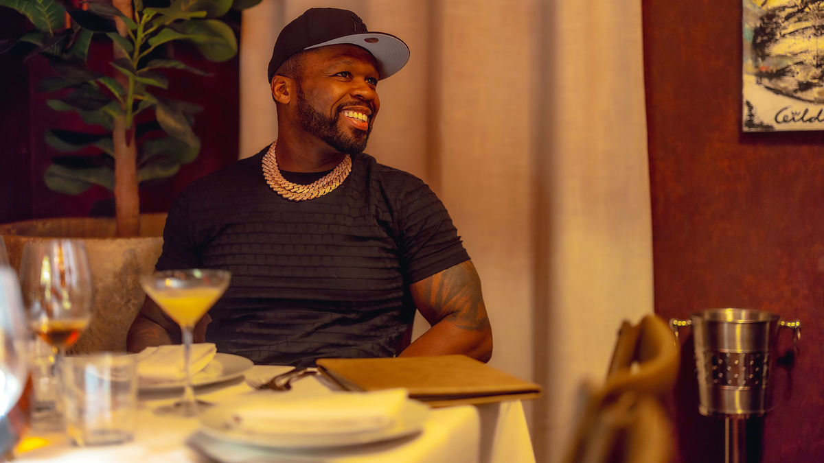 50 cent at a restaurant table