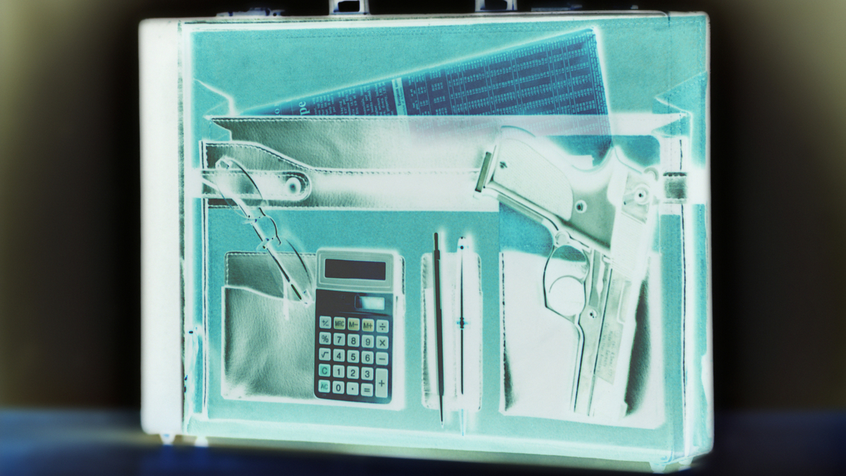 gun in suitcase