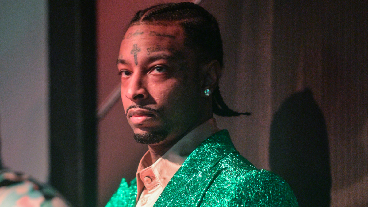 21 savage in a green suit