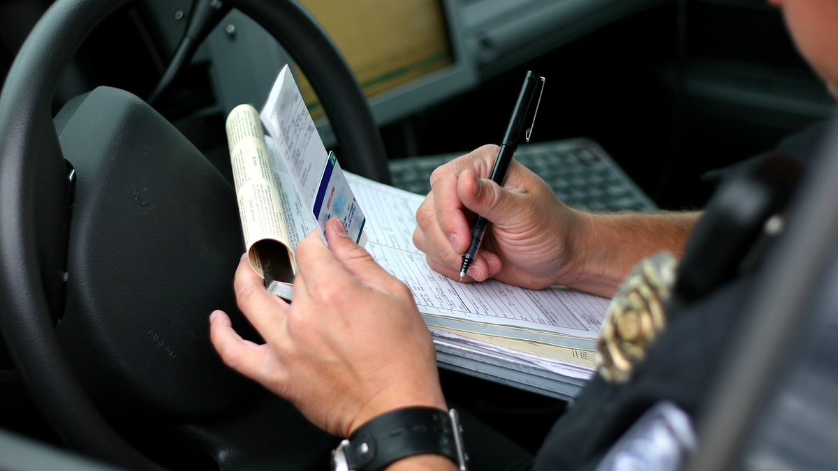 cop writing ticket